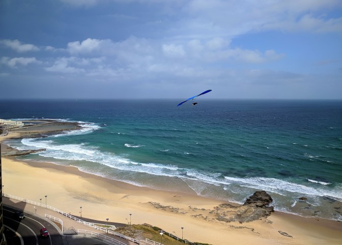 Hang glider over the Newcastle Beach