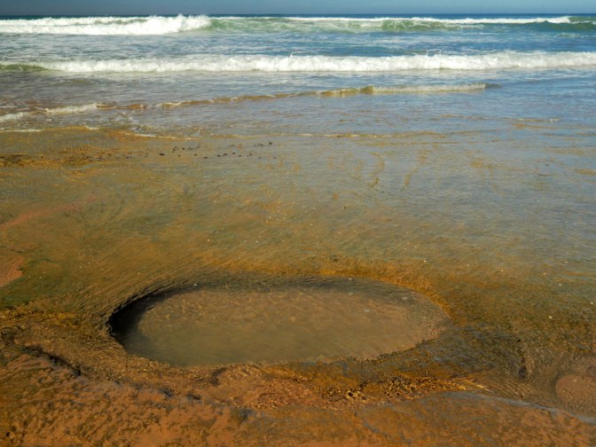 Water carved hole in the rocks
