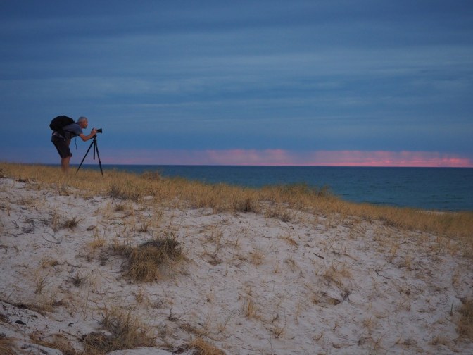 Photographer taking a picture of a photographer taking a picture of a sunset