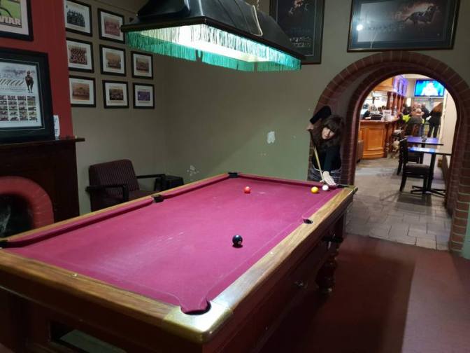 Pool Shark Jenni potting the black