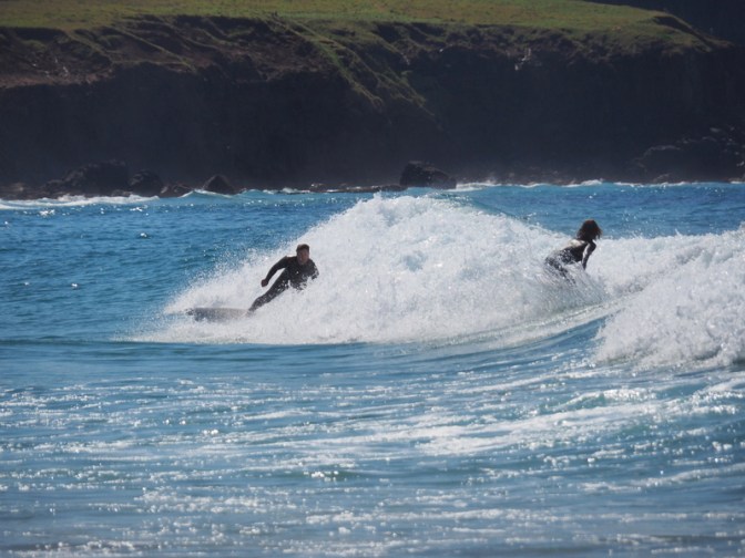 Surfers surfing in the surf